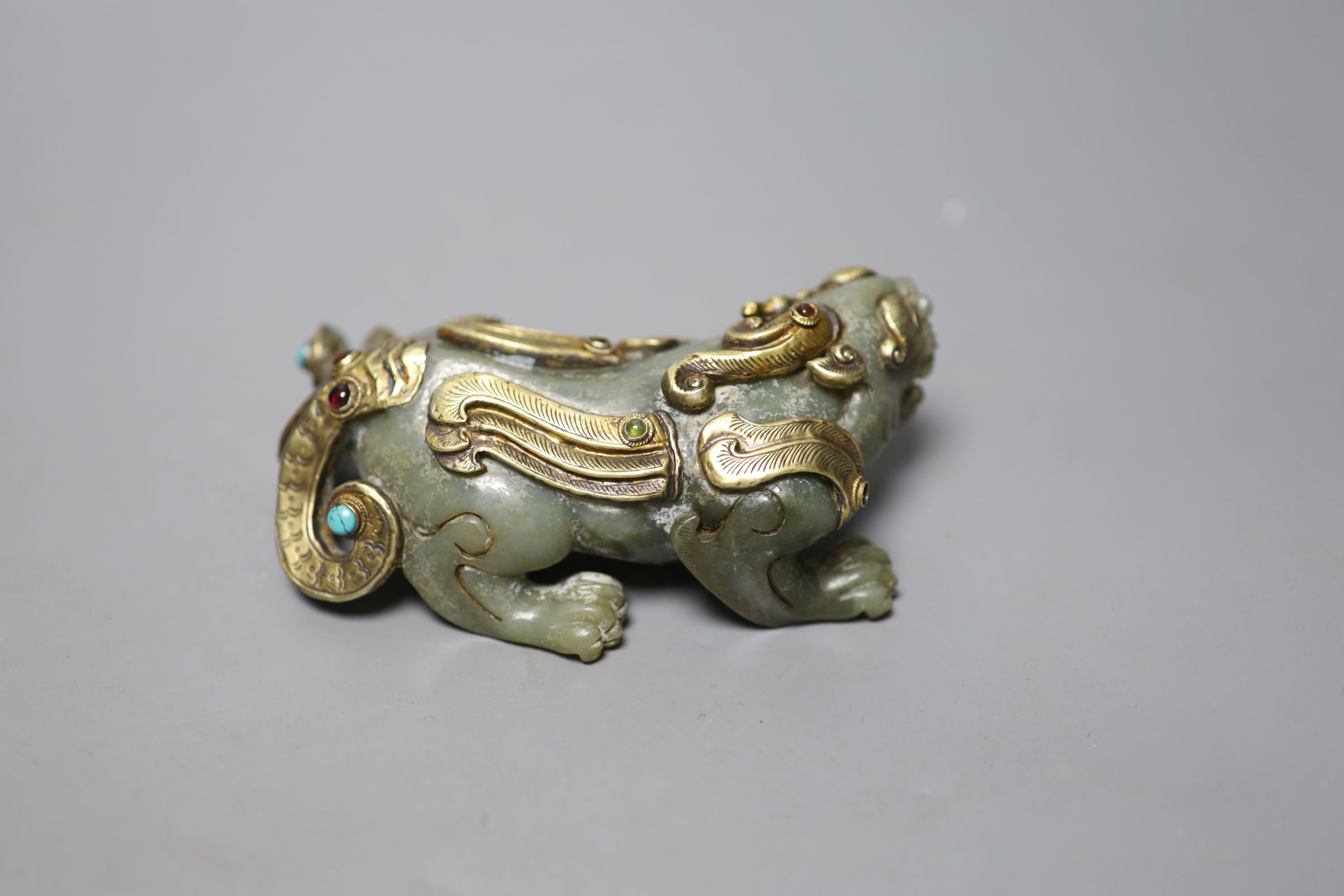 A Chinese celadon jade and gilt metal mounted figure of a Pixiu, 12cm long